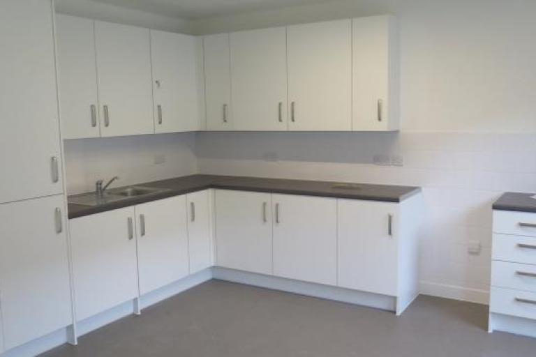 Inside newly constructed flat view of newly fitted kitchen