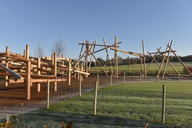 Wooden climbing frames on a bright and sunny day
