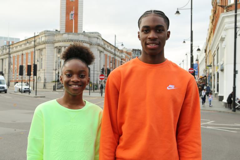 Smiling boy and girl outside Lambeth Town Hall