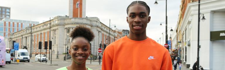Smiling boy and girl outside Lambeth Town Hall
