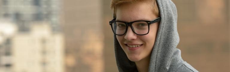 photo of teenager wearing glasses