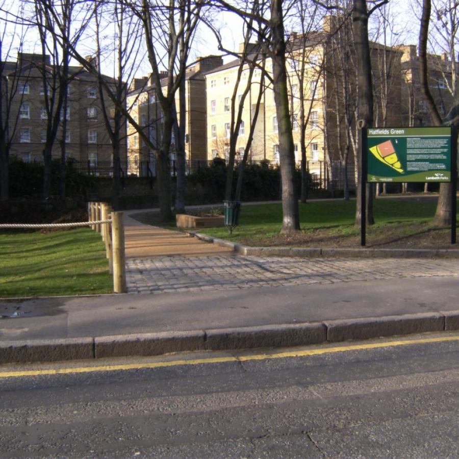 View of Hatfields green with signage, paths and fencing