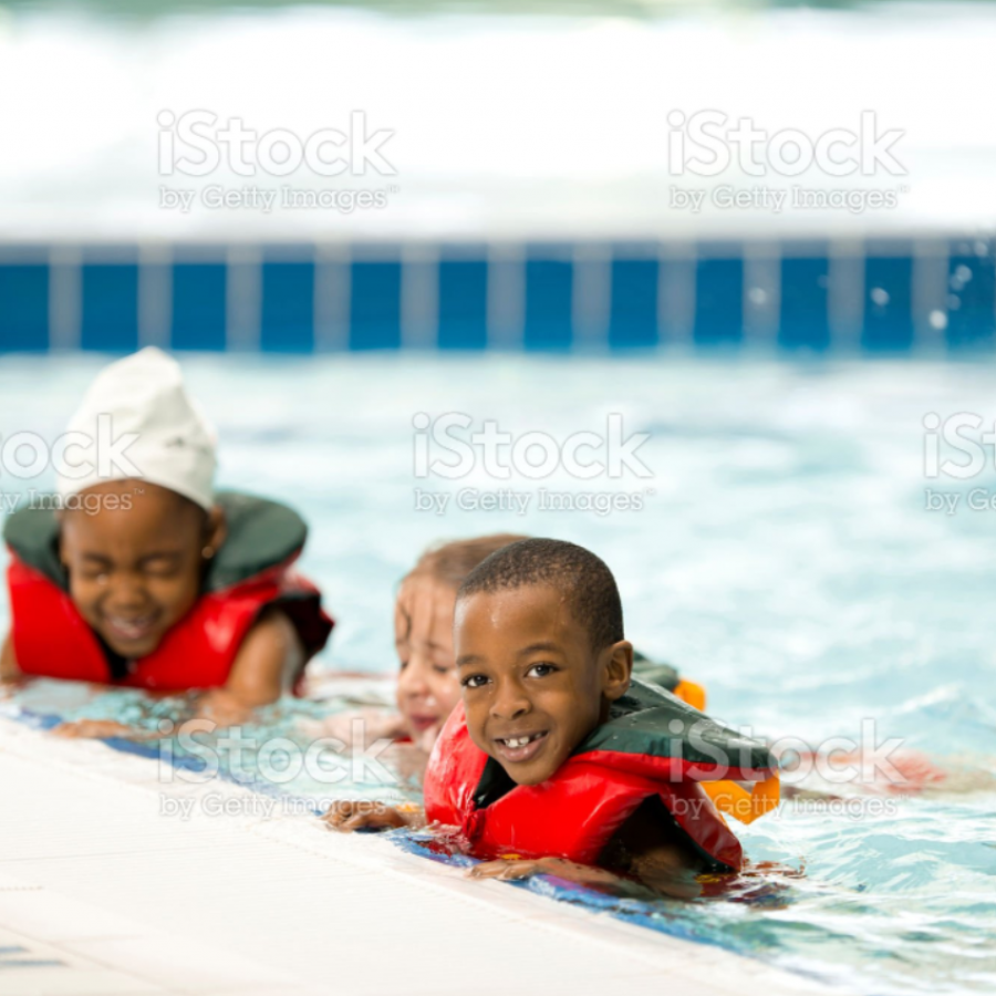black children in a swimming pool